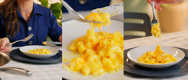 Creamy mac and cheese served in white bowls with a golden cheese topping